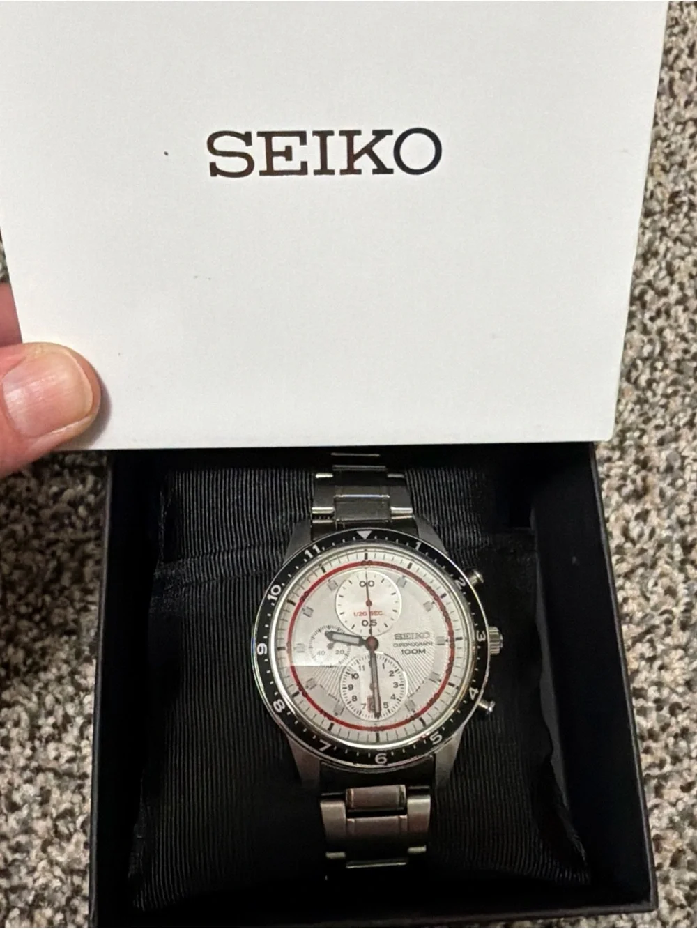 Seiko Silver Watch with White Dial and Red Accents